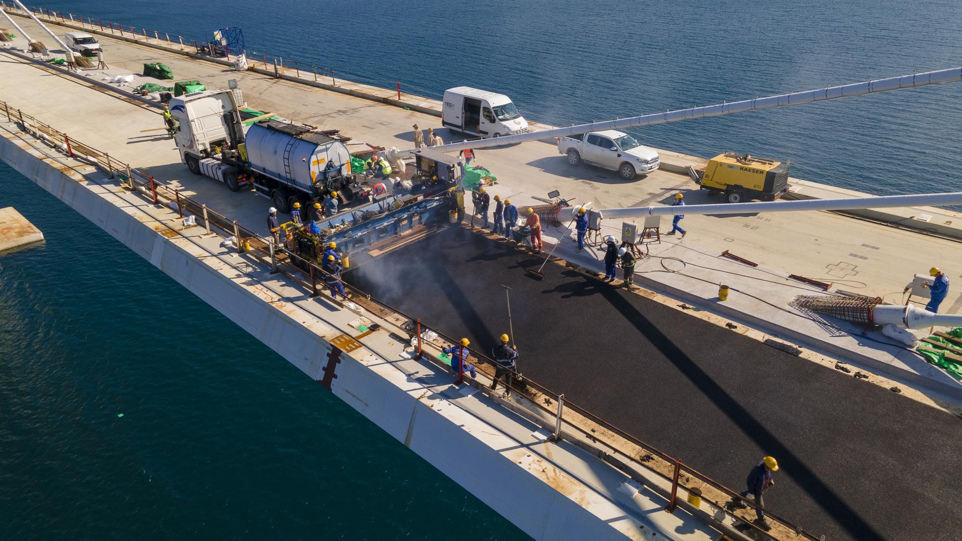 Pelješac Bridge gets first layer of asphalt