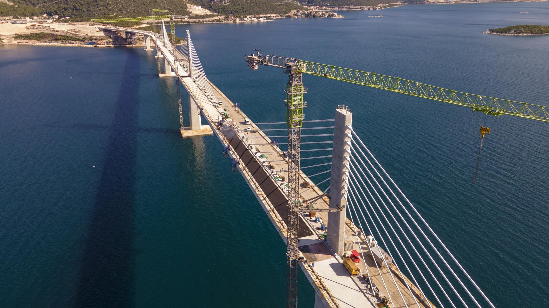 Pelješac Bridge gets first layer of asphalt