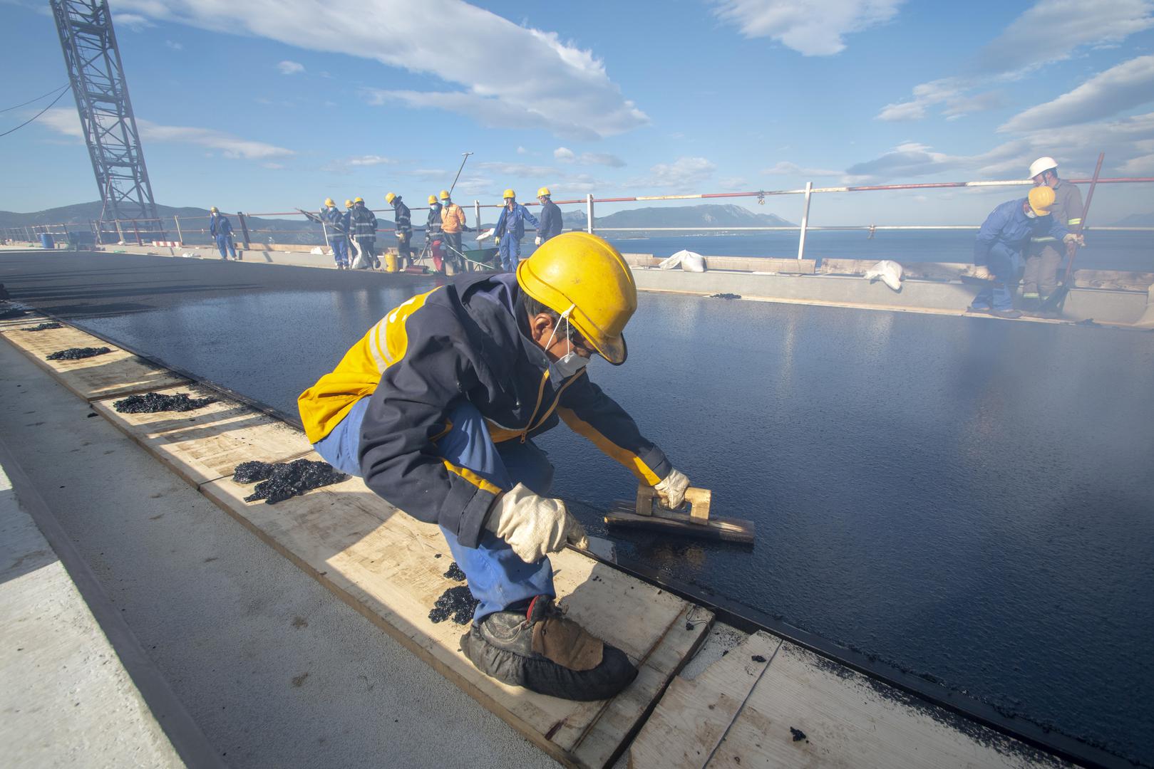 Pelješac Bridge gets first layer of asphalt