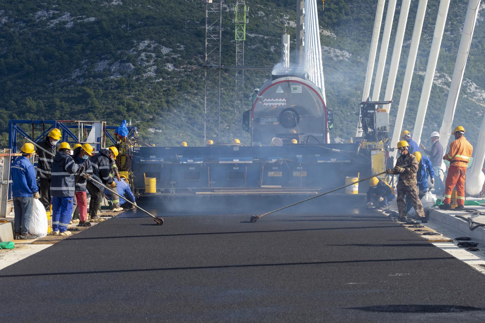 Pelješac Bridge gets first layer of asphalt