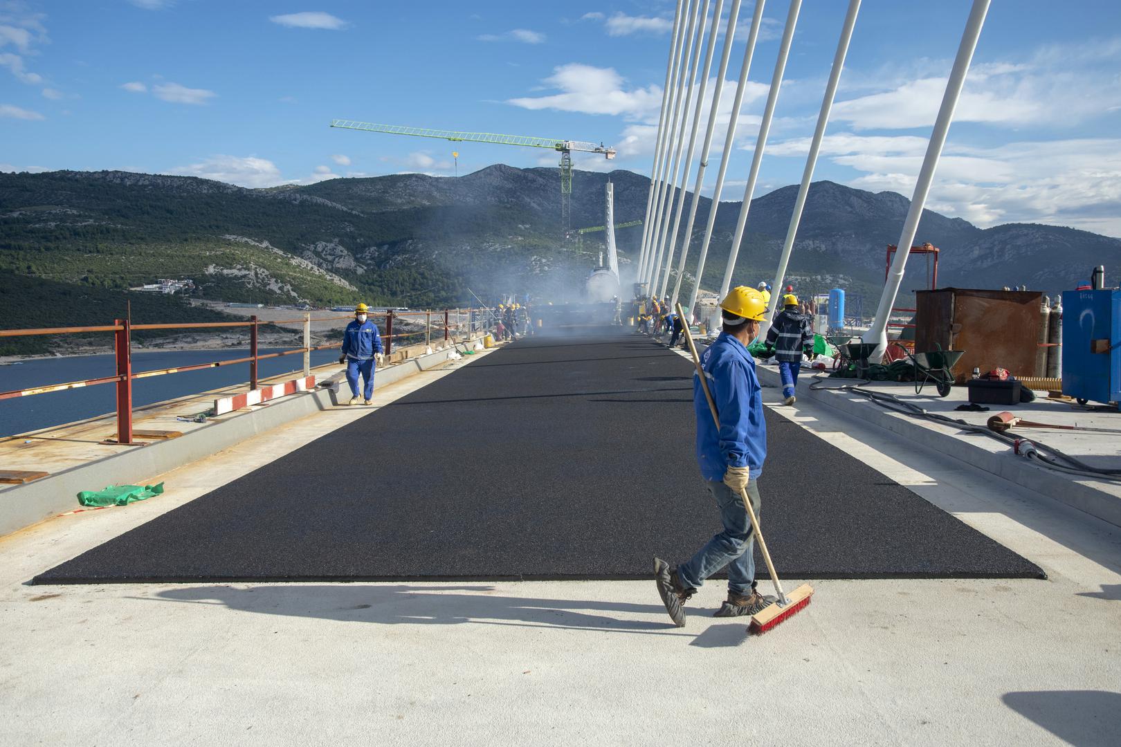 Pelješac Bridge gets first layer of asphalt